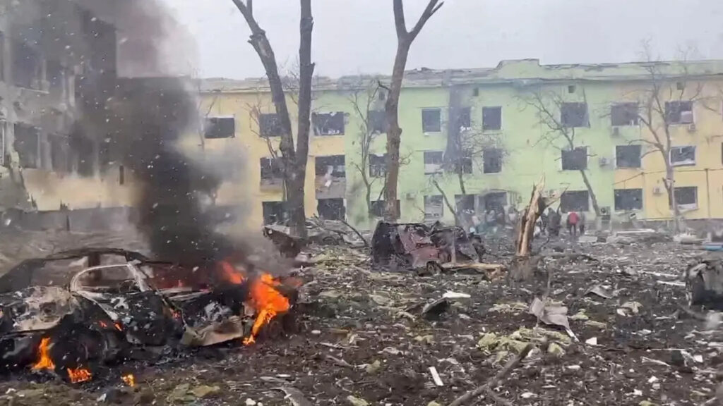 Cars and a hospital building destroyed by an air strike in Mariupol